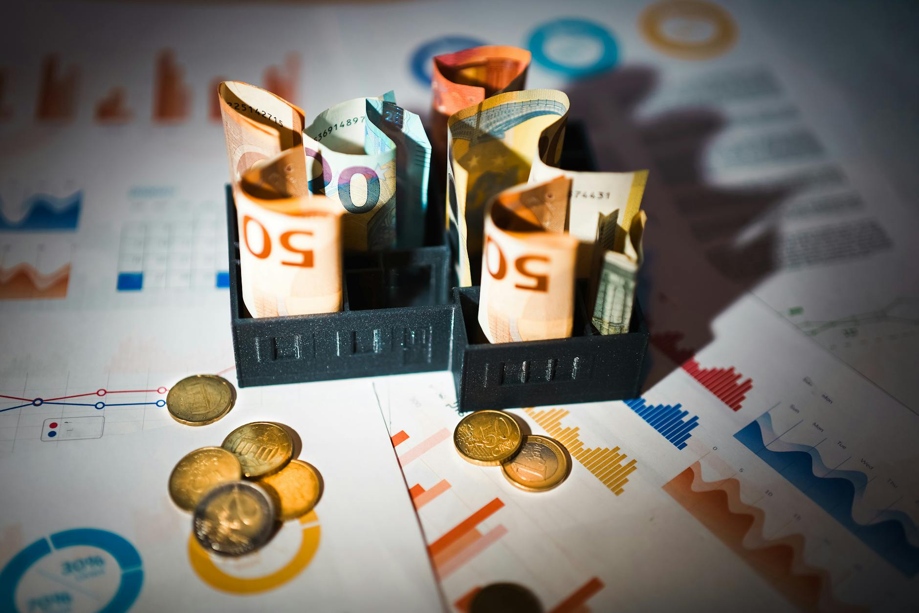 https://www.pexels.com/photo/euro-banknotes-and-coins-on-financial-charts-30515366/